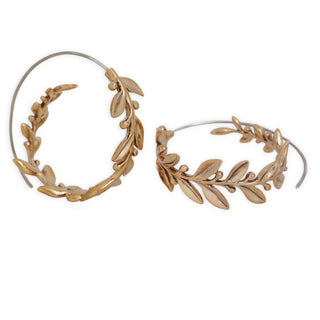 Bronze hoop earrings with leaf designs on a white background