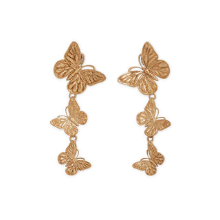 Bronze butterfly earrings on a white background