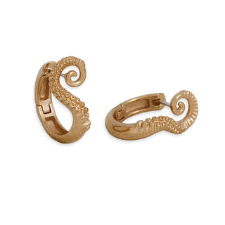 Gold octopus-shaped earrings on a white background
