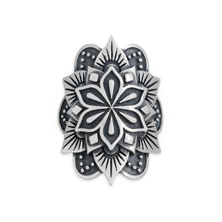 A silver-toned metal ring featuring an intricate, symmetrical mandala or lotus flower design with raised patterns and dark recessed details, shown on a plain white background.