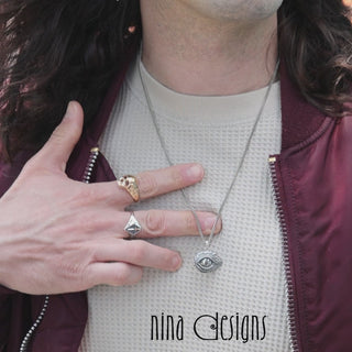 Video of male model wearing Sword Signet Ring, Bronze Skull Ring and a Dragon Eye Necklace