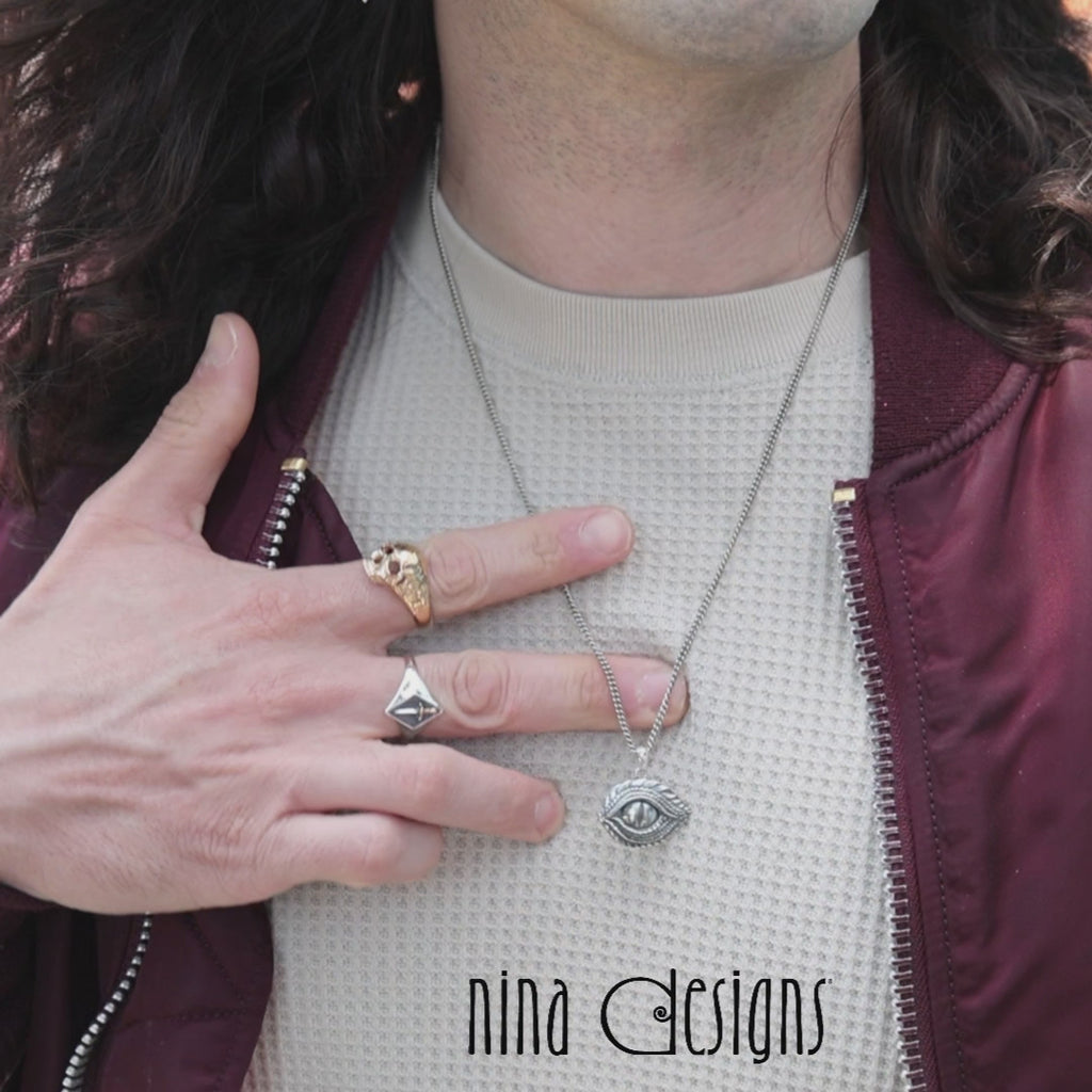 Video of male model wearing Sword Signet Ring, Bronze Skull Ring and a Dragon Eye Necklace