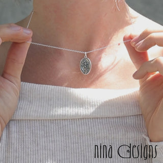 Video close-up of Narcissus Birth flower Necklace on model